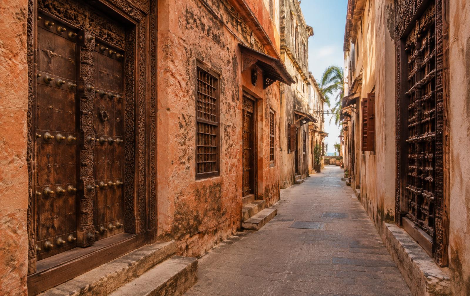 Carved wooden doorways in the narrow lanes of Stone Town, Zanzibar